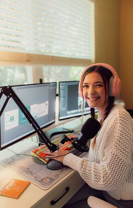 Person working at a computer desk.
